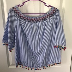 Off the shoulder Pom Pom shirt.